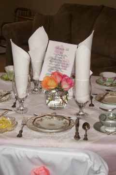 Every table set with beautiful antique linens and china